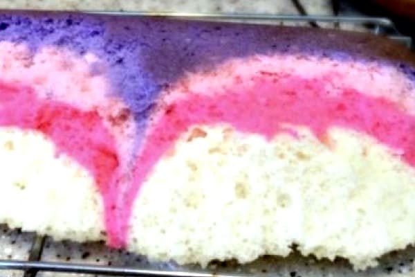 How To Make Tie Dye Cake a slice of cake with different colored layers