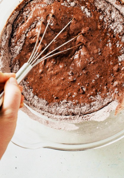 Can you make cookies from chocolate cake mix in mixing bowl on table with hand whisking