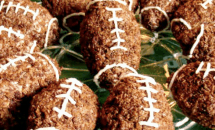 Chocolate Football Rice Krispie Treats rice crispy treats shaped like footballs on a plate