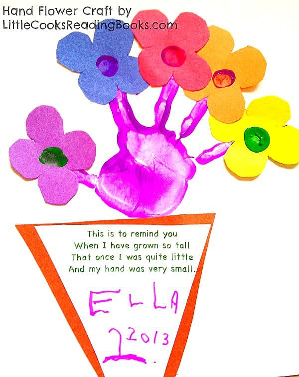 How to Make Handprint Flowers Craft - stamped handprint on colored paper with paper flower cutouts on each finger to make a flower bouquet