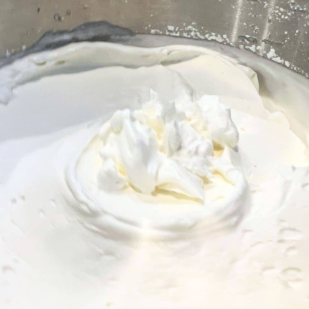 IMPORTANT WHIPPED CREAM TIP Chill The Mixing Bowl - close up of homemade whipped cream in a metal mixing bowl