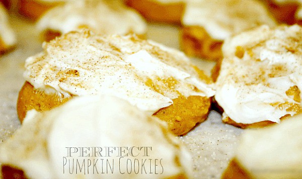 how to make pumpkin cookies - text over image of iced pumpkin cookies on a table for fall festival