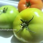 Fried Green Tomatoes green tomatoes and a red tomato on a counter