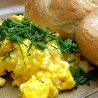 How To Make Scrambled Eggs on a plate with rolls