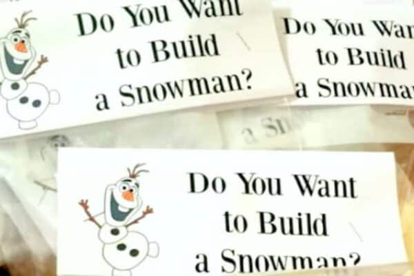 Do You Wanna Build A Snowman Treat Bags with snowman kits in a Christmas basket