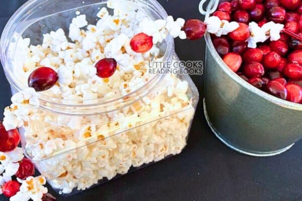 cranberry popcorn Christmas garland on a Christmas craft table