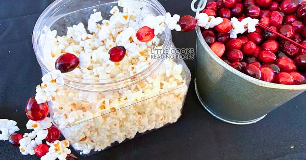 How To Make A Popcorn Garland for Christmas cranberry popcorn Christmas garland on a Christmas craft table