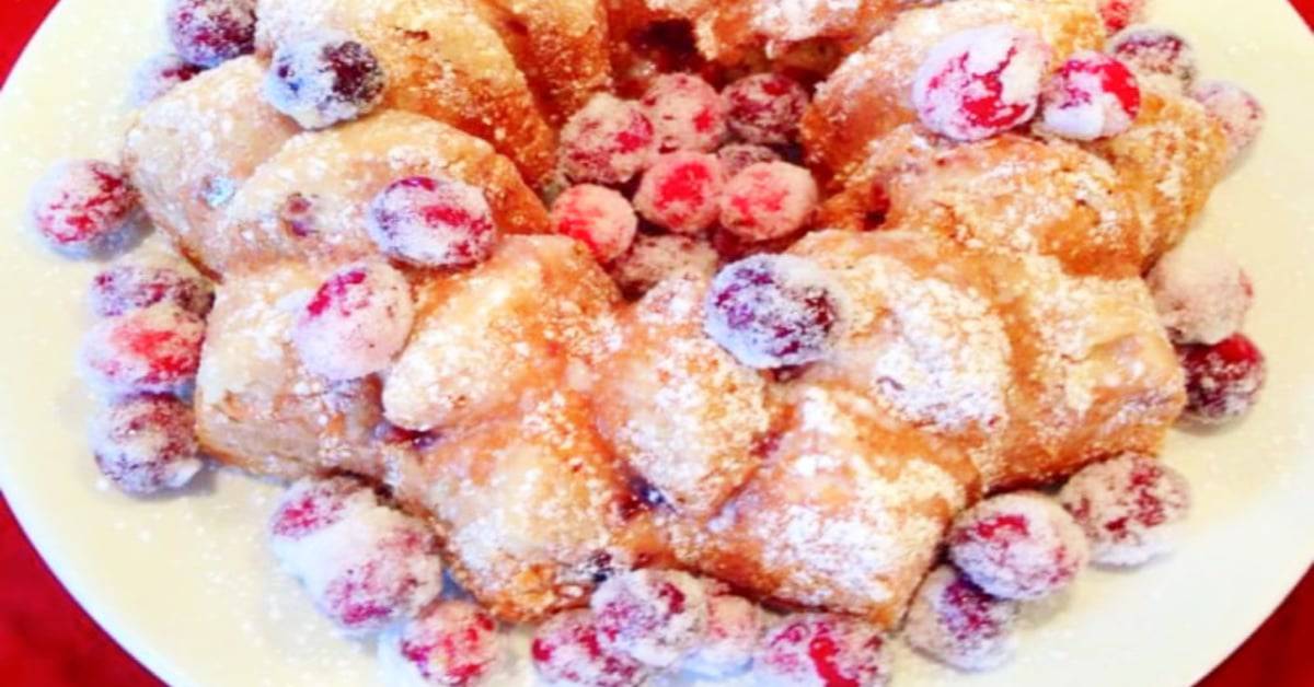 How To Sugar Cranberries (cranberry candies garnish for holiday cakes) with sparkly sugared cranberries on a Christmas bundt cake dessert