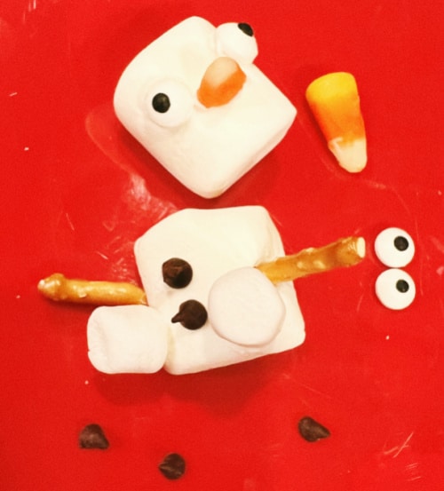 do you want to build a snowman kit assembly with marshmallow snow man parts on a red plate