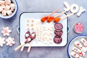 hot chocolate board tray with marshmallows, chocolate spoons and cookies