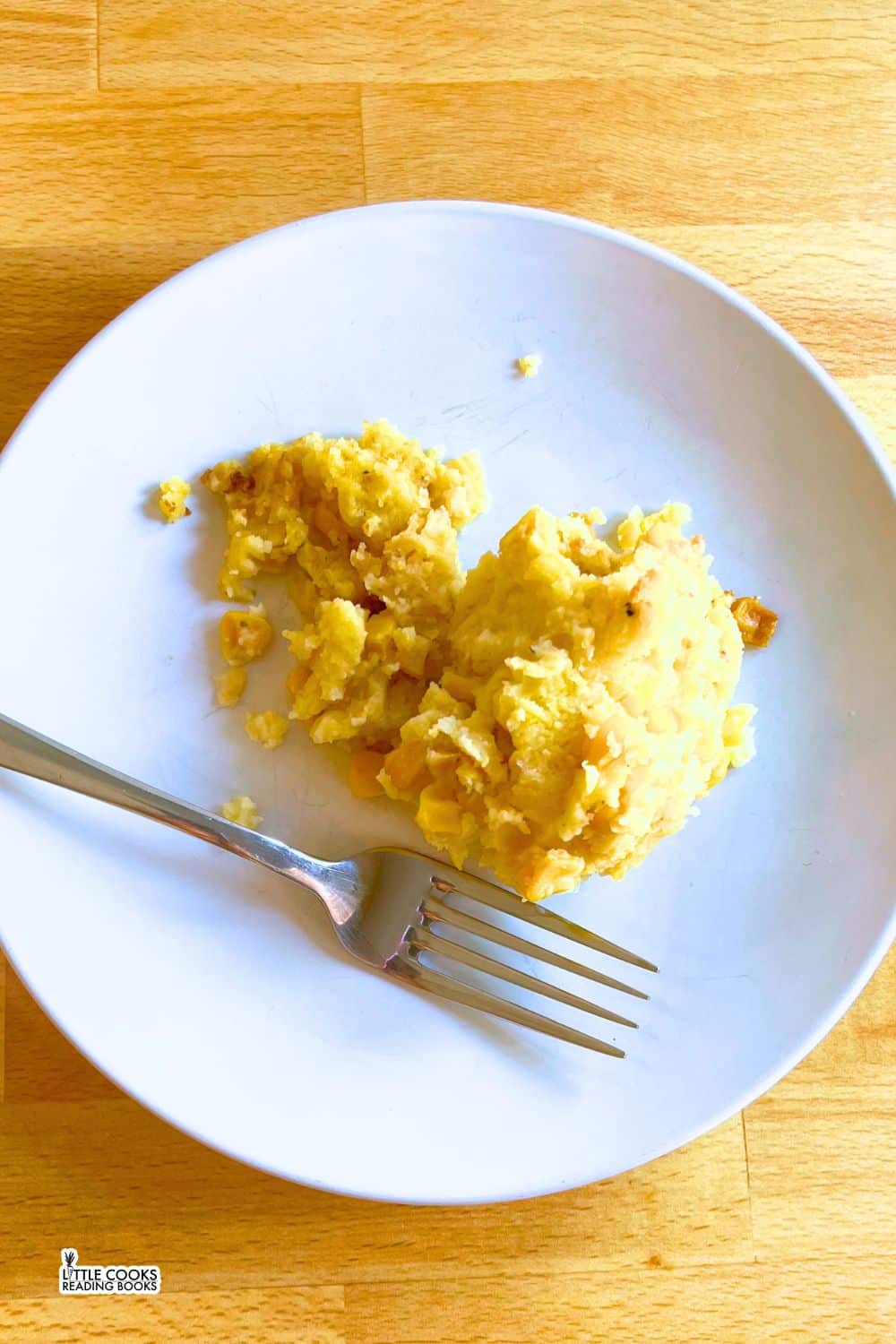 Slow Cooker Corn Pudding Casserole Slow Cooker Corn Pudding Casserole on a white serving plate with fork