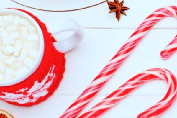 What To Do With Leftover Candy Canes (what to do with candy canes) hot chocolate and old candy canes on a white Christmas table