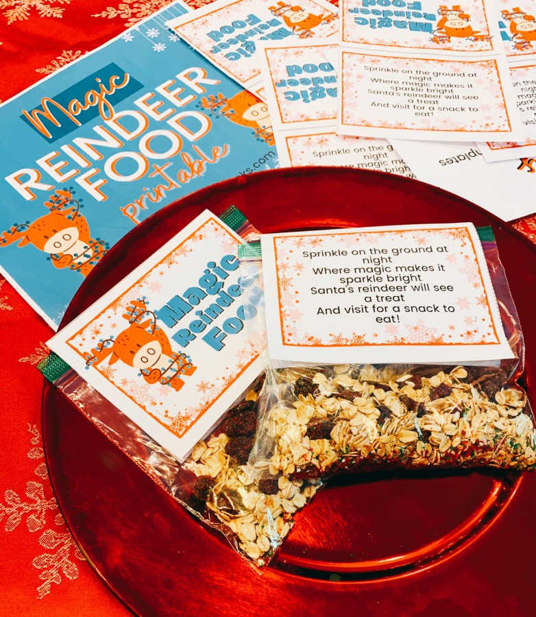 What do reindeer eat at Christmas? This DIY Reindeer food recipe! (Get magic reindeer food poem printables free!) on a red plate with Christmas printable labels around it