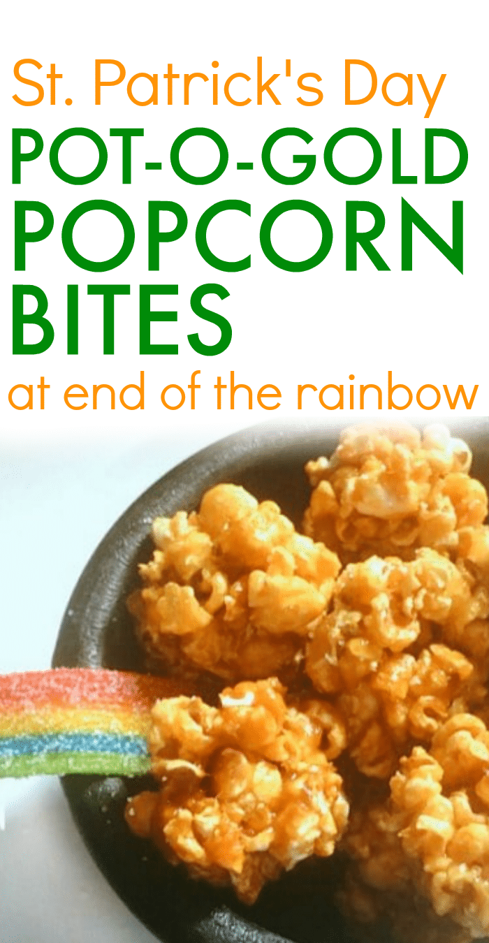 St. Patrick's Day Snacks: Pot-O-Gold Popcorn Bites text over a black bowl filled with caramel corn popcorn bites with a rainbow tape candy sticking out of the side