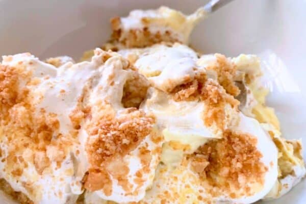 How To Make Banana Pudding Homemade - No Cook Old-Fashioned Homemade Banana Pudding from scratch in a white bowl with spoon - great for Banana Dessert Recipes, Dessert Dips, Pudding Desserts or Mini Desserts