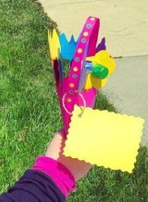 How To Make May Day Baskets close up of a colorful paper may day basket with paper flowers