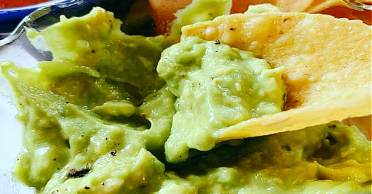 Recipe for Homemade Guacamole on a tortilla chip