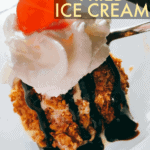 Recipe For Fried Ice Cream in the Air Fryer text over fried ice cream in white bowl with chocolate syrup drizzle, whipped cream and cherry on top