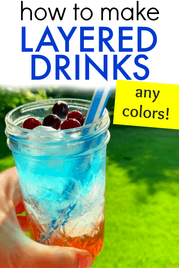 Patriotic red white blue layered drink (Fun July 4th recipes for kids!) red white blue layered drink in a clear glass being held up to sun