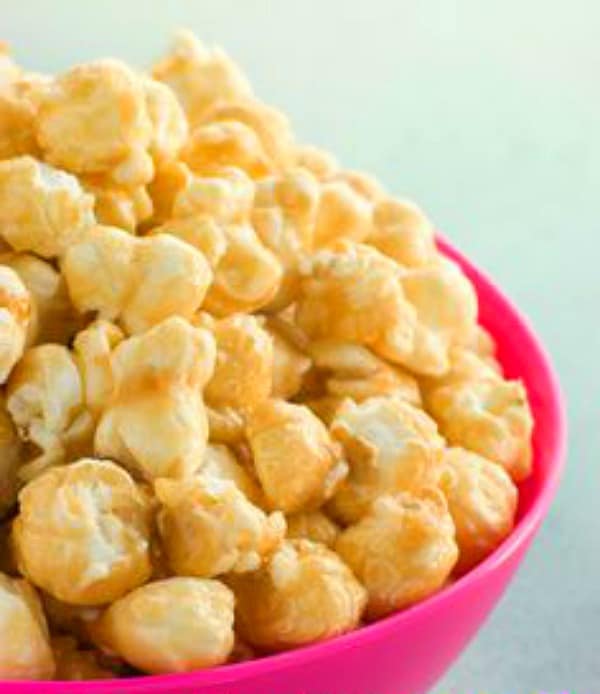 toffee popcorn in a pink bowl