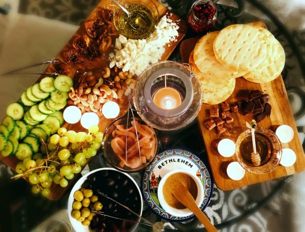 Host a Bethlehem Dinner: looking down at a table filled with Bethlehem dinner items