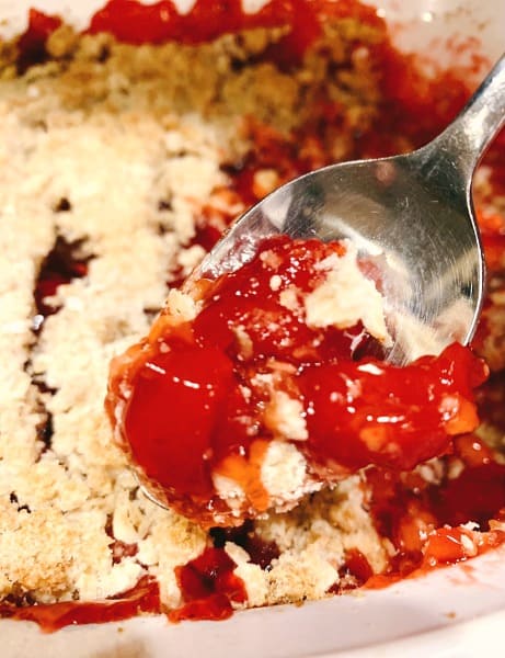cherry crumb pie recipe with canned cherries on a spoon