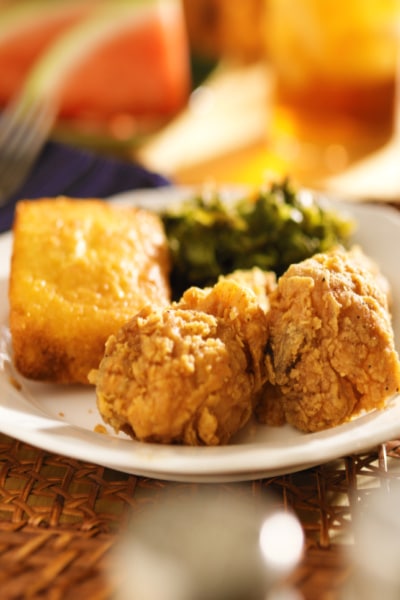 What was MLK's favorite food: fried chicken, cornbread, collard greens on a white plate