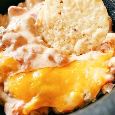 Recipe for Cheese Dip tortilla chip in sausage cheese dip