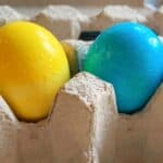 How to dye eggs with food color: Ultimate Guide to Using food color to dye eggs: Using food color to dye eggs vibrant colored easter eggs sitting in an egg carton