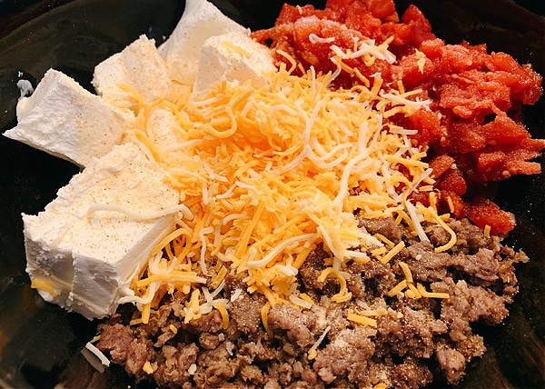 cheese dip with sausage ingredients in a slow cooker