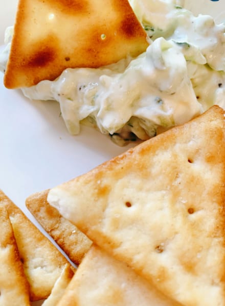 Cucumber Dip with Crackers on a plate