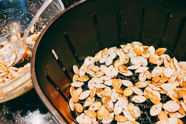 Air Fried Pumpkin Seeds in air fryer basket