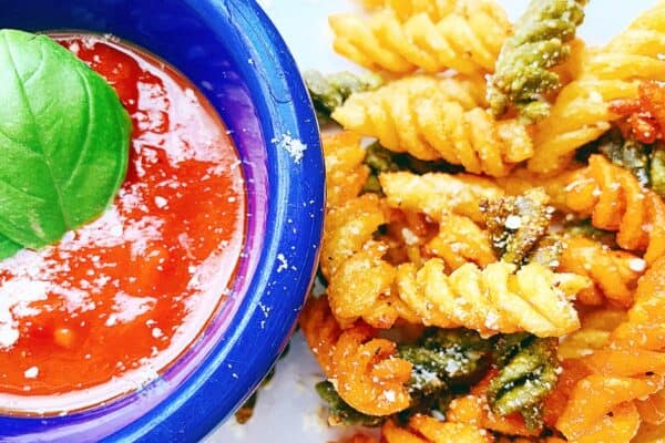 air fryer pasta snack on a plate with marinara sauce in a blue dipping dish