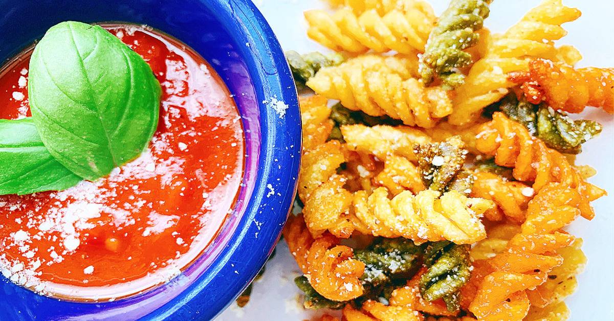 air fryer pasta snack on a plate with marinara sauce in a blue dipping dish