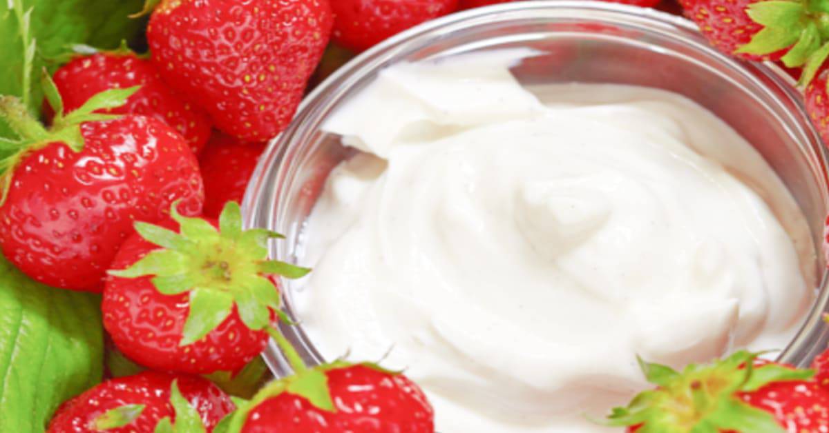 Dip Recipe For Fruit strawberries next to a bowl of fruit dip