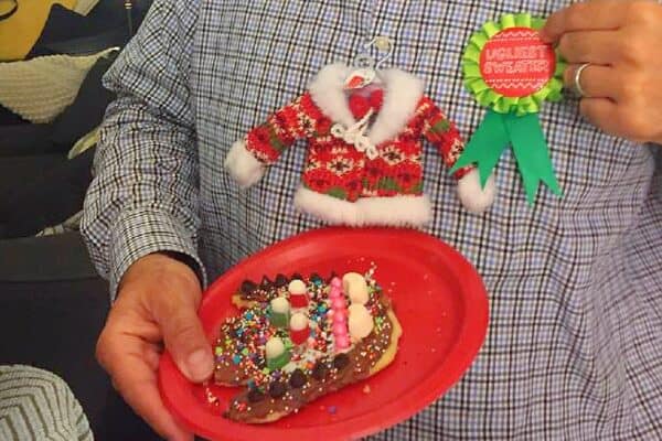 ugly Christmas sweater cookie decorating party (BEST Christmas decorating party idea!) with ugly sweater cookie and ugly sweater ribbon