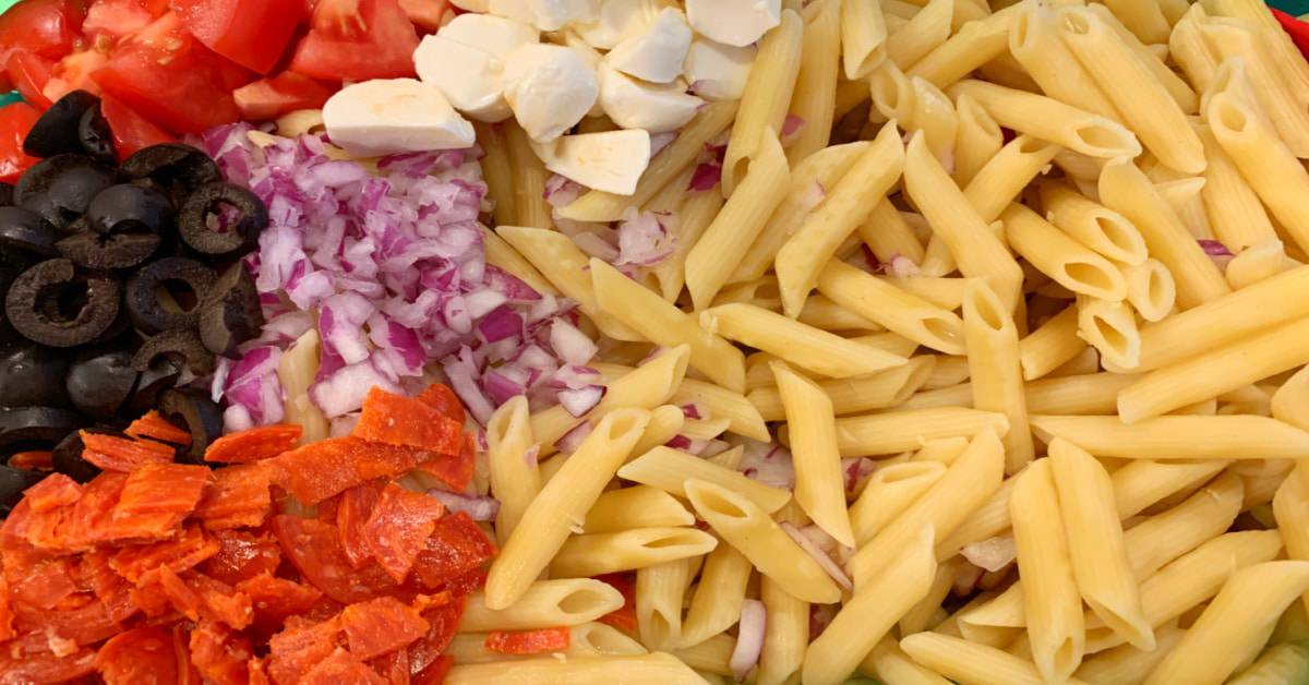 Simple pasta salad with pepperoni: recipe for Italian pasta salad (Italian pasta salad with pepperoni and parmesan cheese) close up of pasta salad ingredients