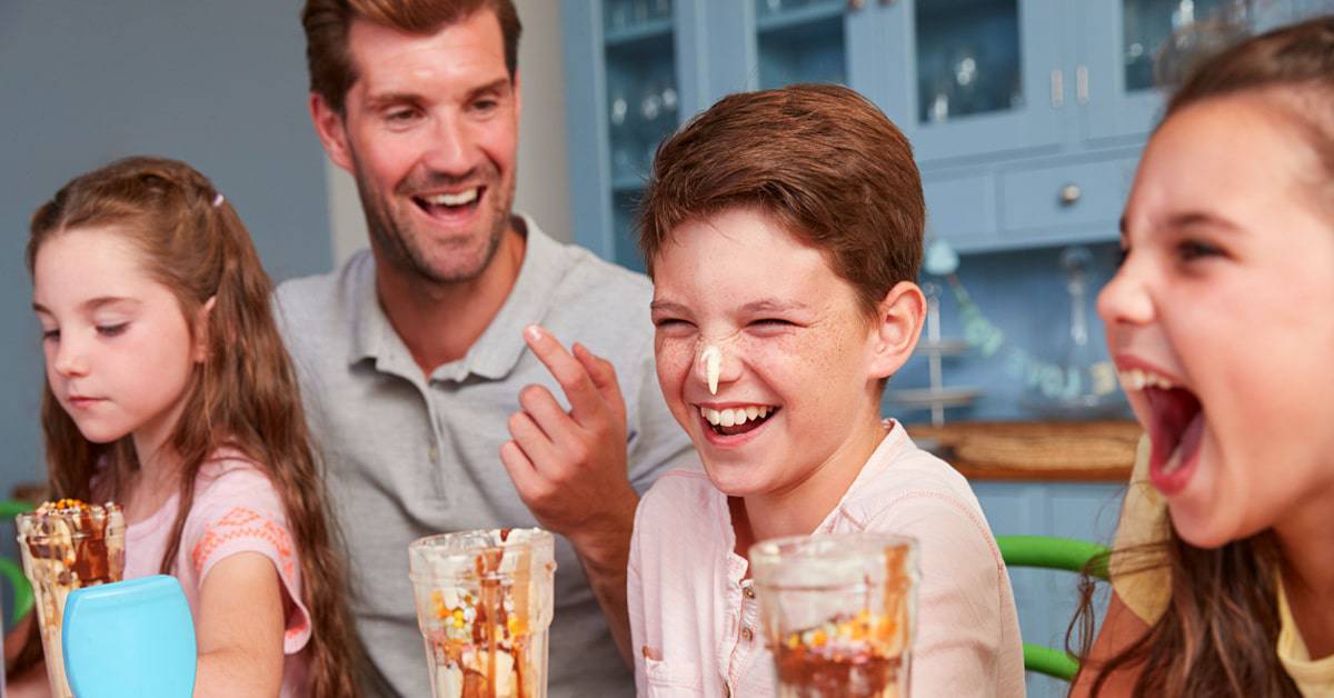 Roll a sundae game - family laughing over playing ice cream sundae game
