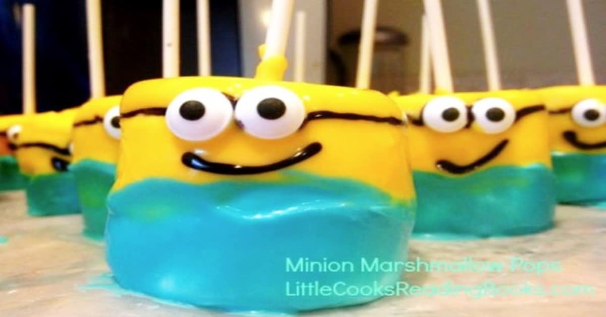 how to make minion pops decorated marshmallow minions sitting on a sheet of wax paper