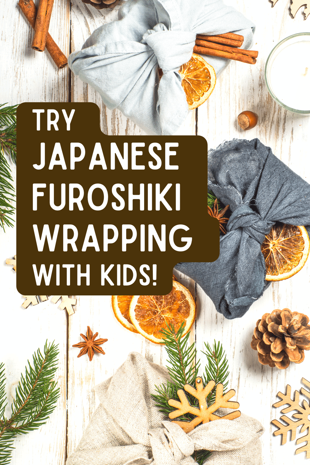 Japanese furoshiki wrapping cloths (how to furoshiki with kids) text over top down view of fabric wrapped presents on a white table with nature decorations like pinecones, dried oranges, and evergreen leaves