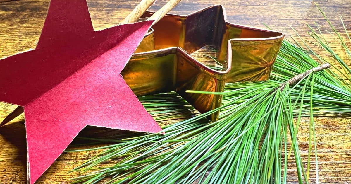 Christmas Tree Star Paper Craft (paper Christmas tree craft ideas) on a table with greenery
