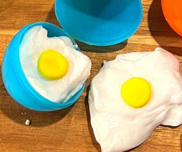 Egg Shaped Slime on a table with plastic eggs