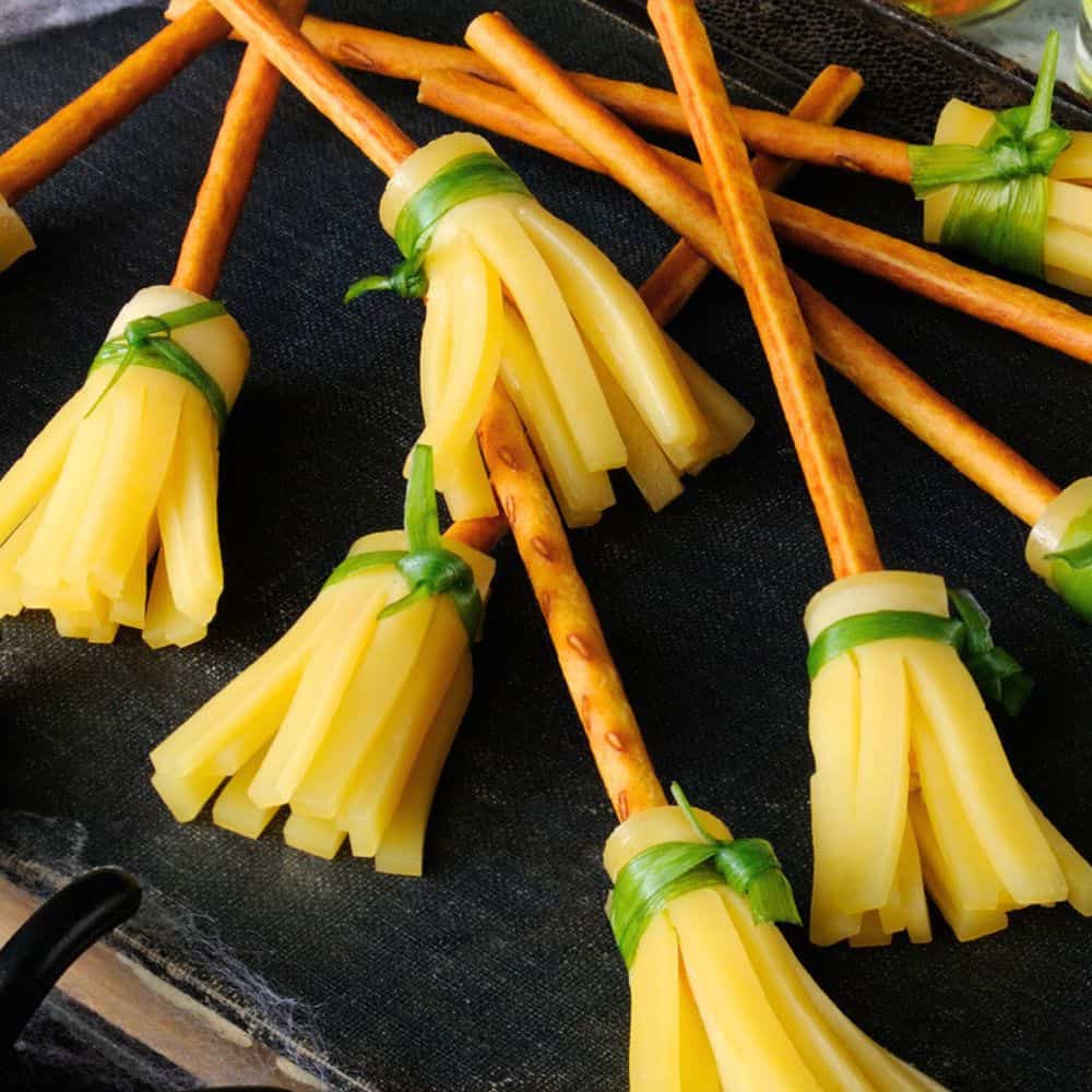 Easy Halloween Witch Brooms from Store Bought Items of pretzel sticks and cheese