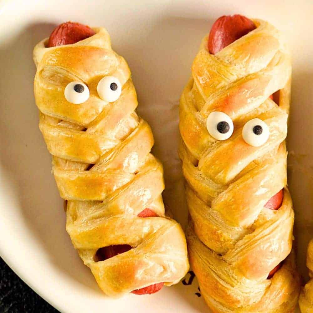 Breakfast Sausage Mummies Halloween Breakfast Ideas Pillsbury mummies wrapped in crescent rolls around sausage