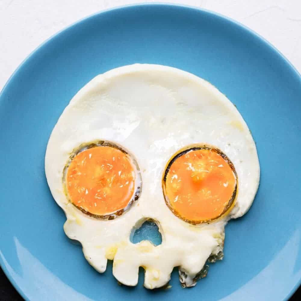 Halloween Skull Eggs (Halloween Egg Ideas) - fried egg in skull shape for Halloween breakfast
