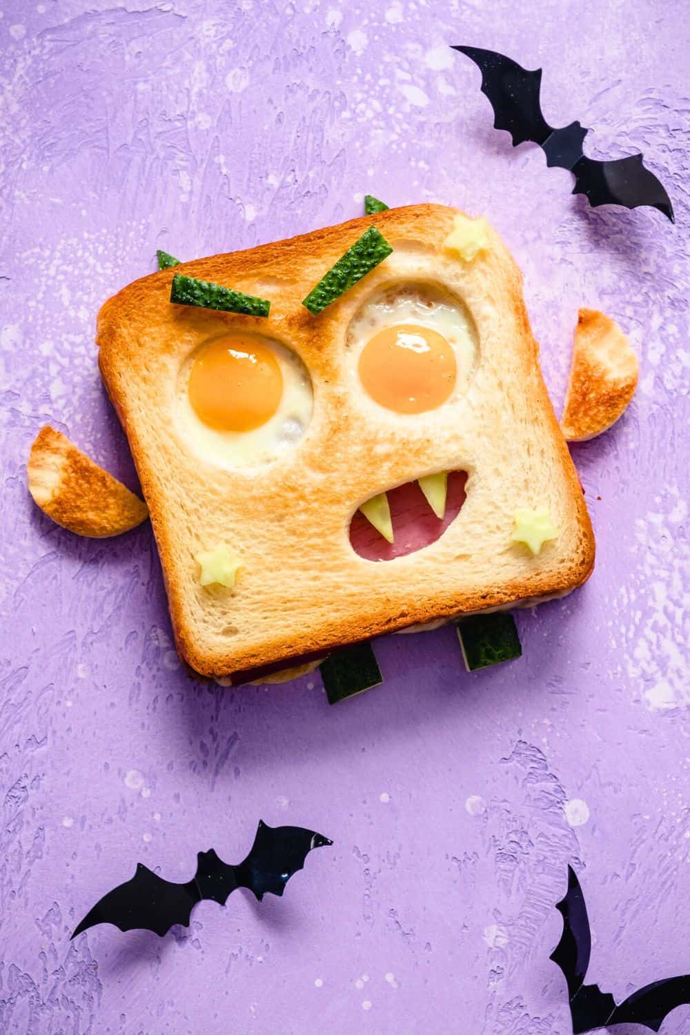 Silly Monster Eggs and Toast Fun Halloween Breakfast Idea cute monster face made out of toast with eggs as eyes