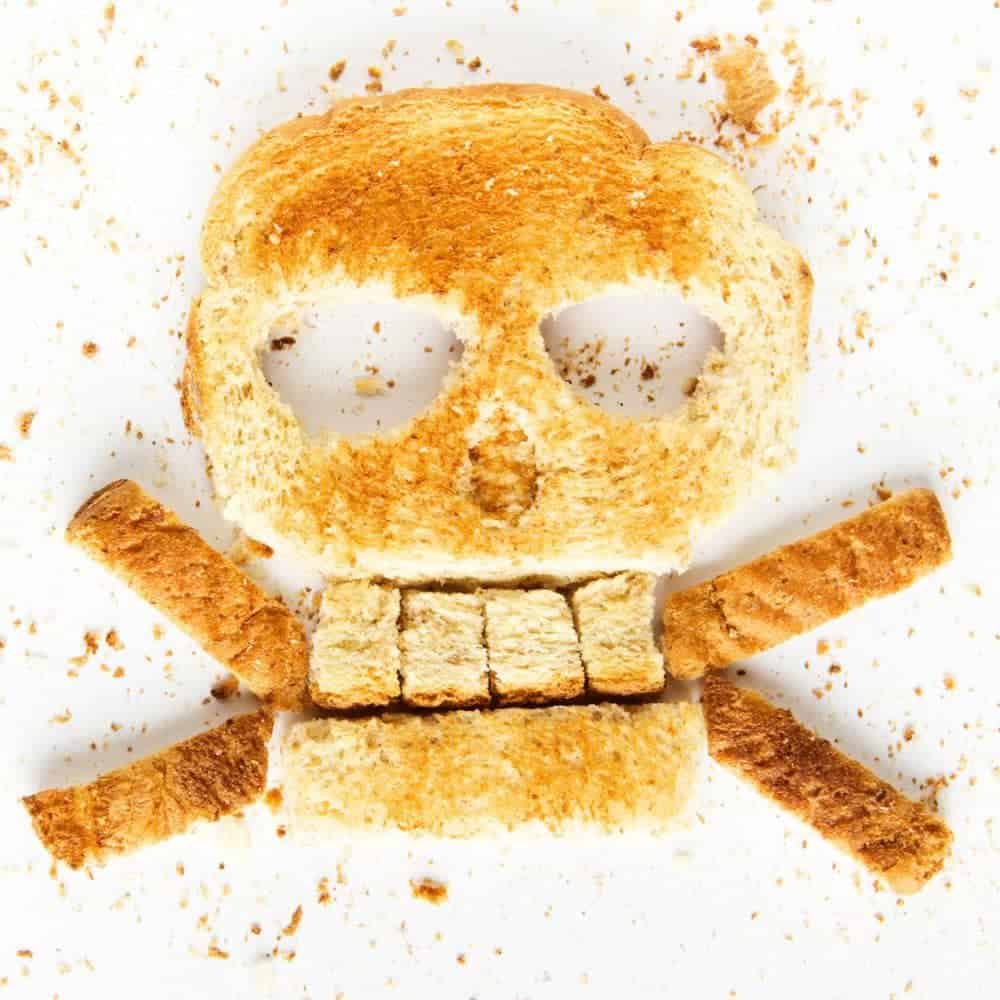 Skull and Bones Toast Halloween Recipe breakfast toast cut into the shape of a Halloween skull and crossbones