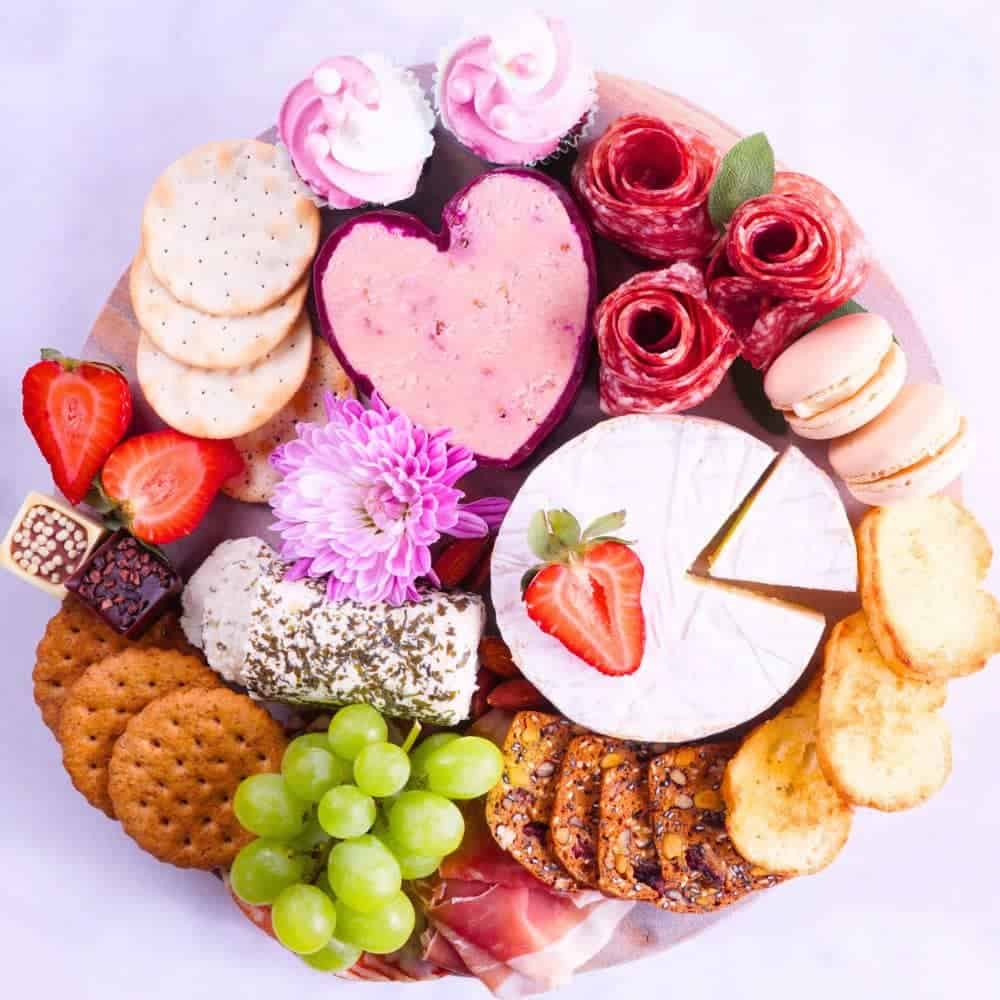 Barbecuterie Board Ideas - party platter filled with pink items 