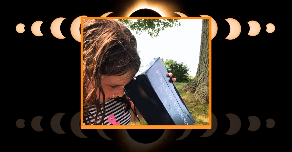 Easy DIY Shoebox Solar Eclipse Pinhole Viewer (solar eclipse DIY projects) - solar eclipse pictures with child looking to a homemade shoebox viewer for eclipse viewing