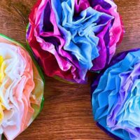 Easy DIY Tissue Paper Flowers Craft For Kids (Flower And Paper Kids Activities) - colorful Mexican paper flowers on a table